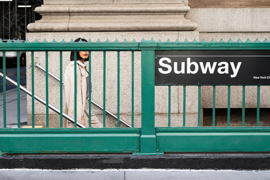 A Woman Walking To Subway